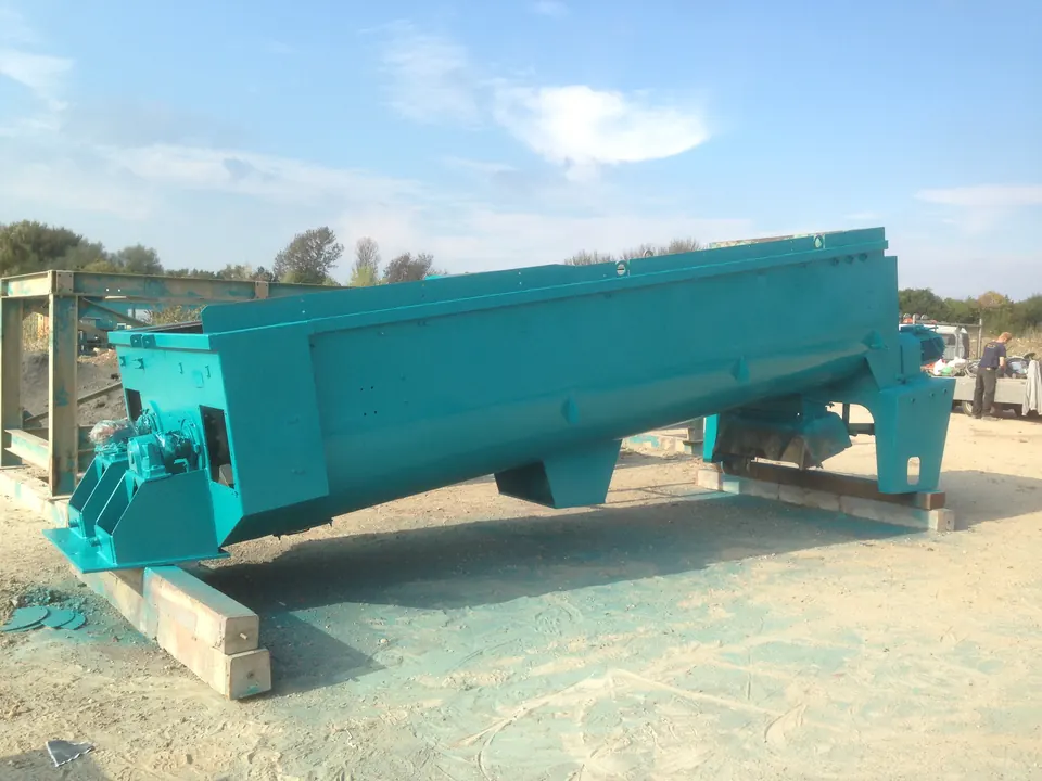 A quarry screening machine blasted and repainted turquoise on site